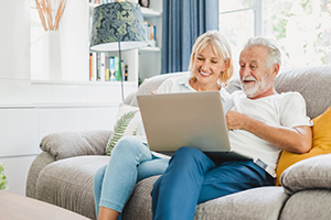 Couple using laptop